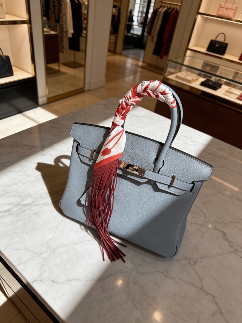 Trendy Fringe Handbag Wrap with Orange Fringe and Bold White Flower Pattern